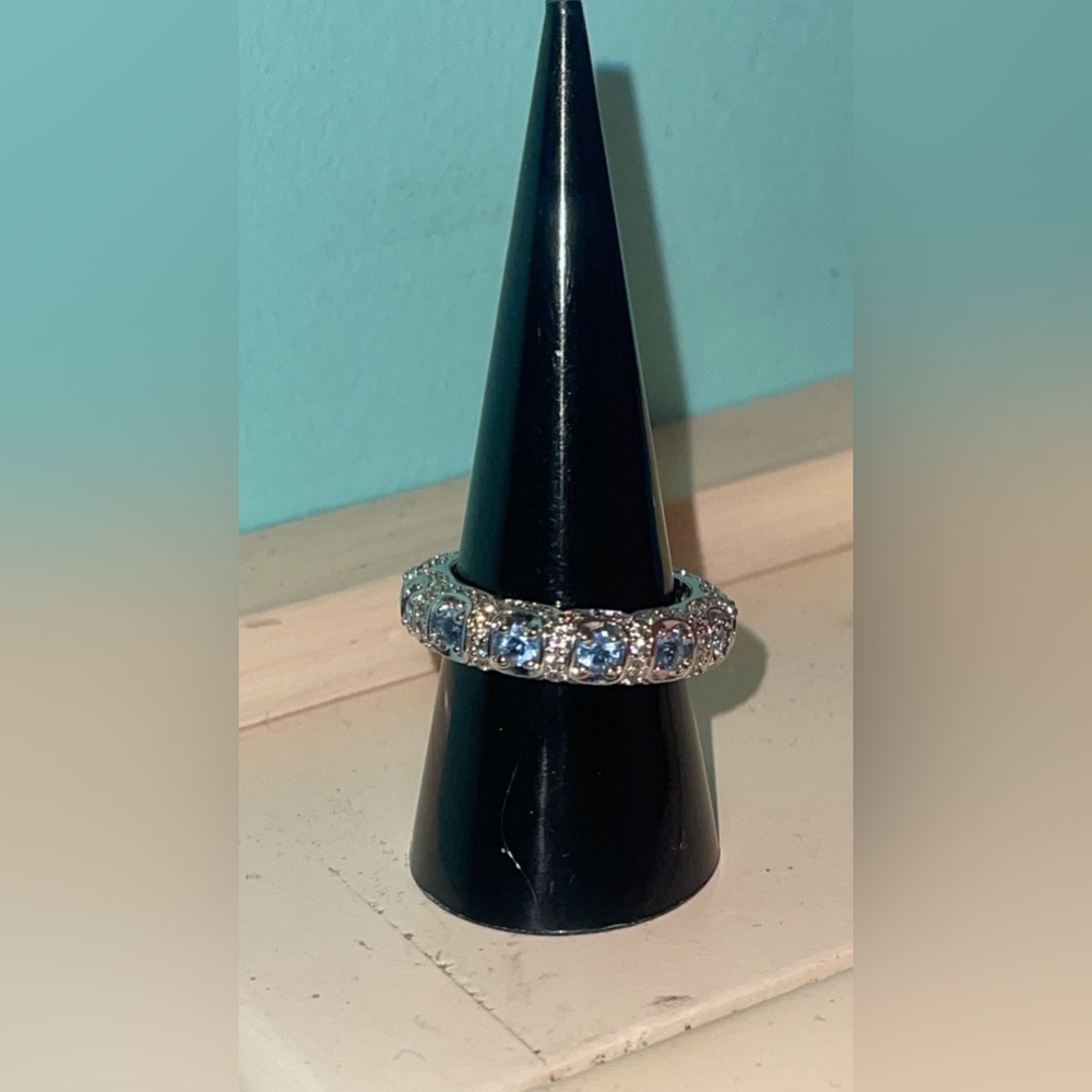 Absolutely stunning Sterling Sliver light blue band size 8
Purchased Price $230